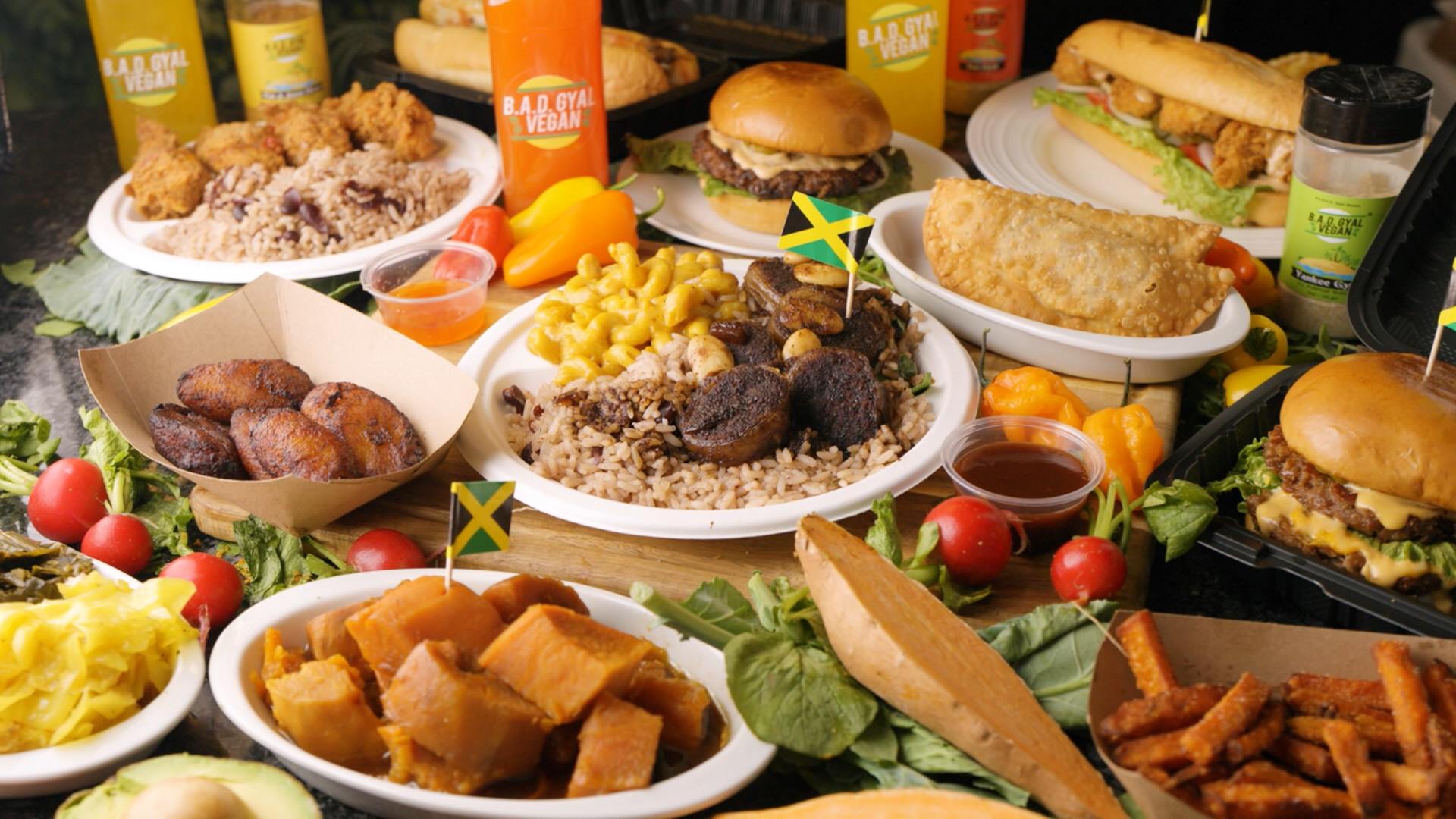 Full B.A.D Gyal Vegan spread — plates, sandwiches, sides, sauces