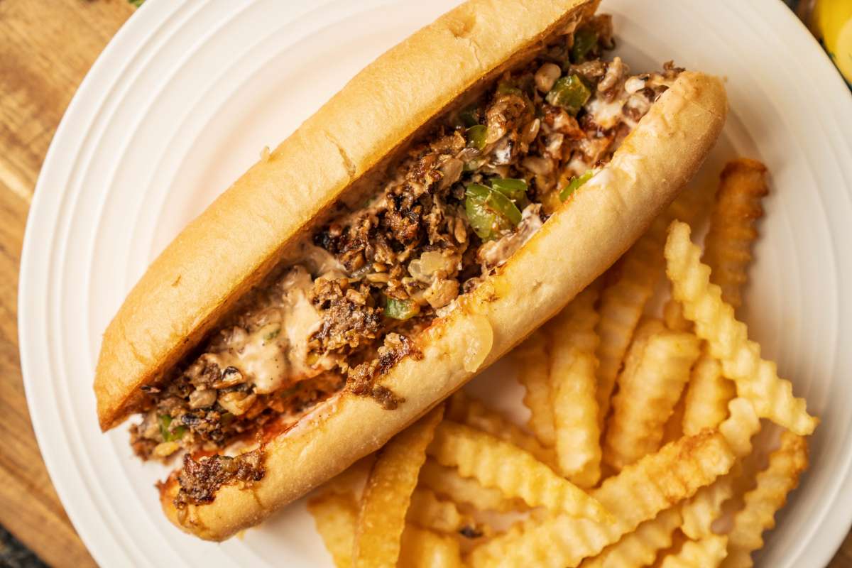Vegan Cheesesteak sandwich with crinkle-cut fries