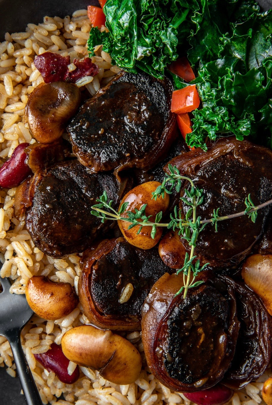 The Voxtail™ — plant-based Jamaican oxtail over rice with kale and thyme